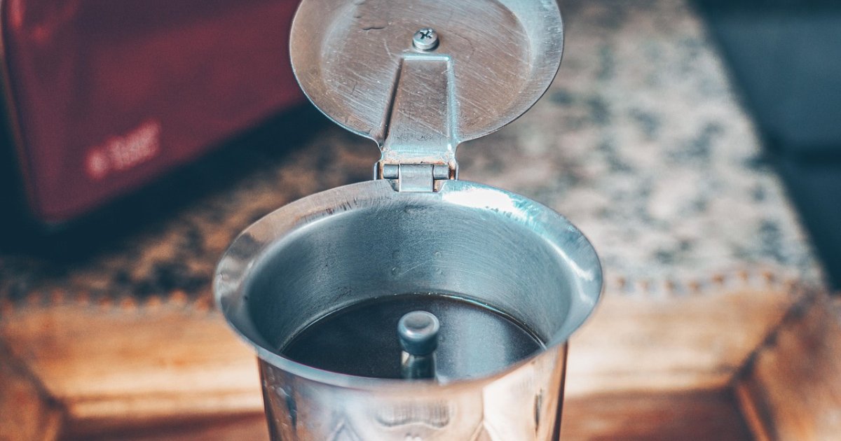 Open stovetop moka pot showing the funnel and the seat where the gasket sits